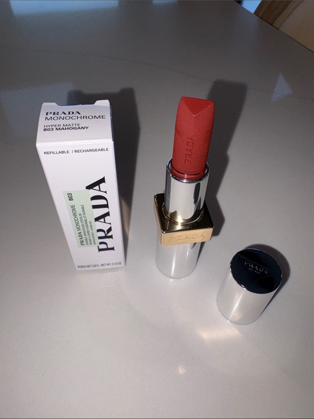Prada Monochrome Hyper Matte Lipstick in shade B03 Mahogany